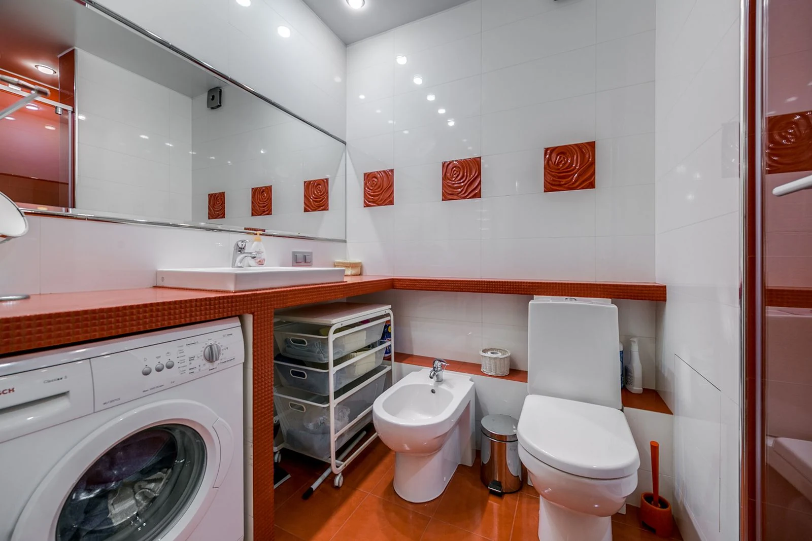 Stylish bathroom with toilet, bidet, and washing machine in a modern design