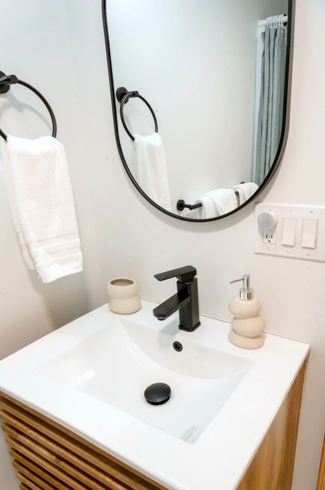 Elegant modern bathroom with minimalist sink and fixtures, perfect for chic interiors