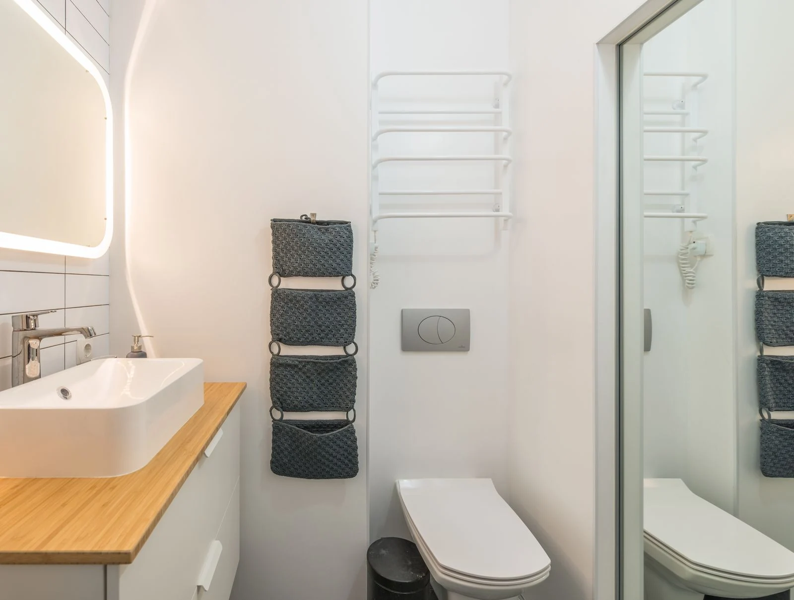 Wood vanity and white toilet